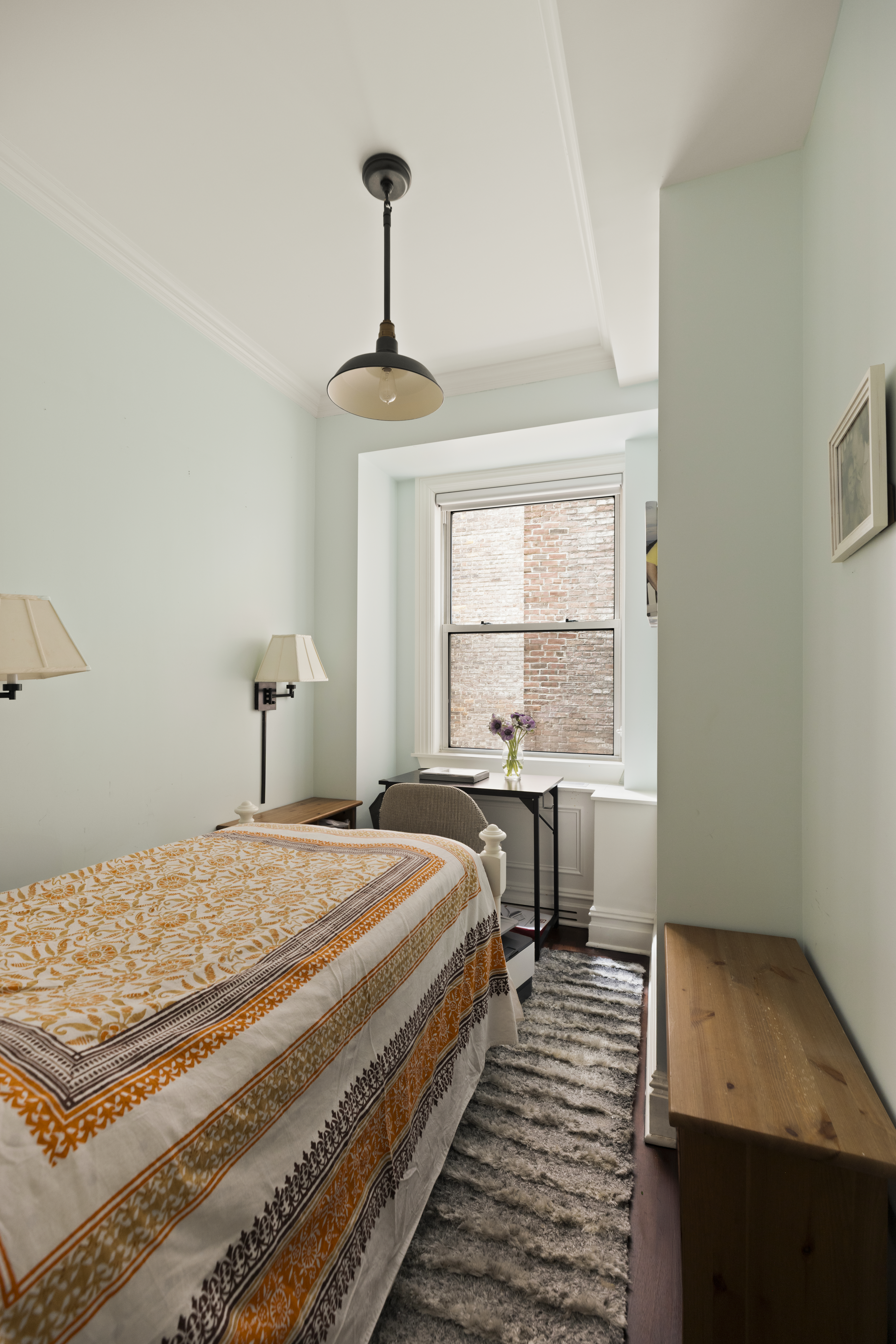1158 5th Avenue, Unit 4A Manhattan, NY 10128 - Photo 17 of 24 a bedroom with a bed and a window