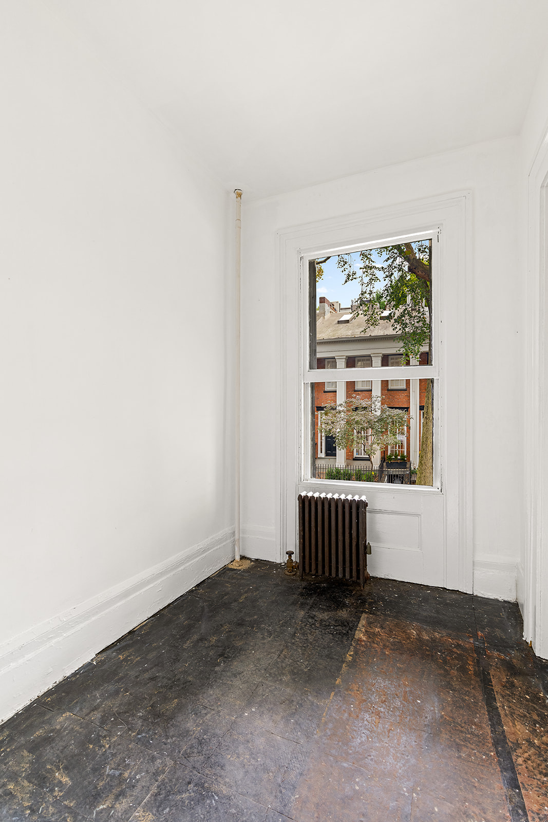46 Willow Place Brooklyn, NY 11201 - Photo 14 of 31 an empty room with wooden floor and windows