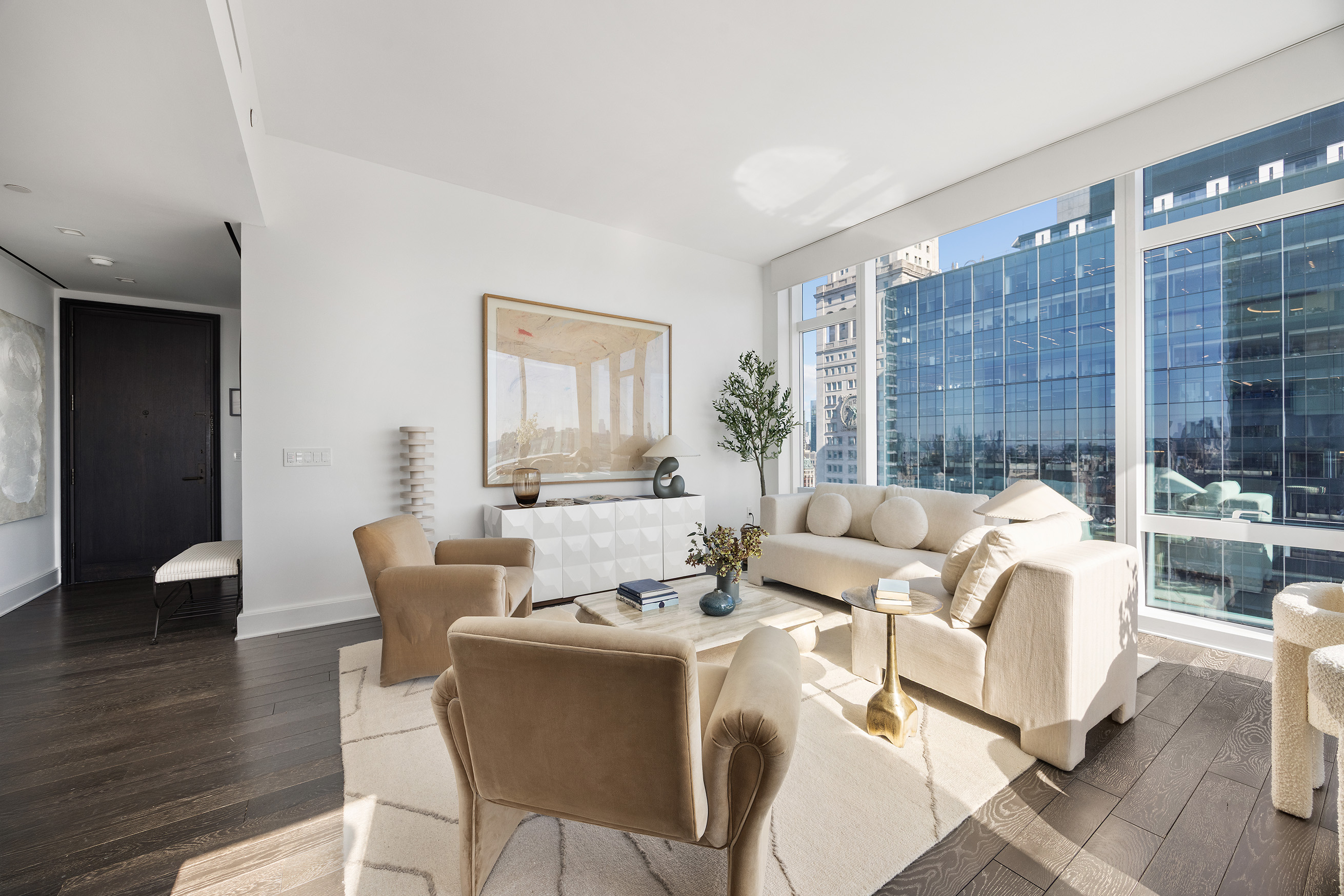 45 East 22nd Street, Unit 32B Manhattan, NY 10010 - Photo 4 of 36 a living room with furniture and a large window