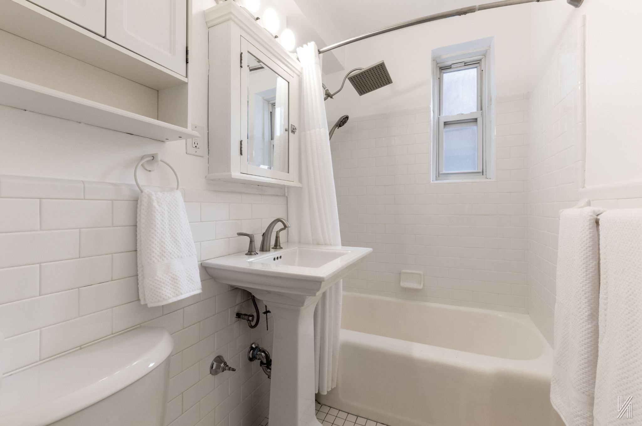 39-55 51st Street, Unit 3G Queens, NY 11377 - Photo 15 of 18 a bathroom with a sink a toilet and shower