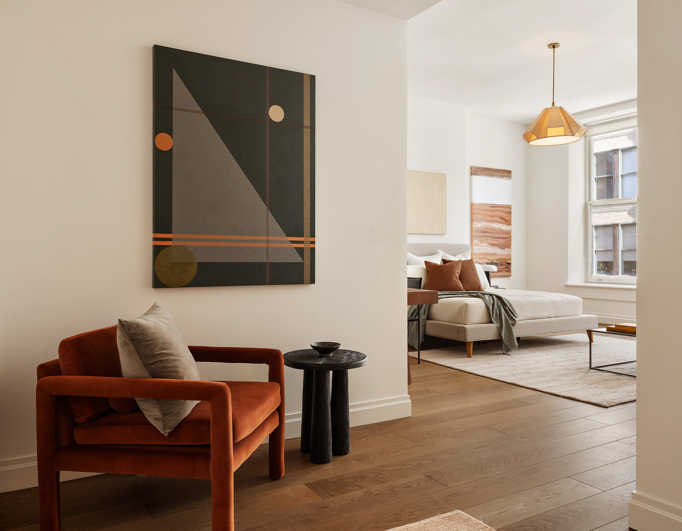 42 East 20th Street, Unit 4AD Manhattan, NY 10003 - Photo 8 of 19 a living room with furniture a window and a lamp