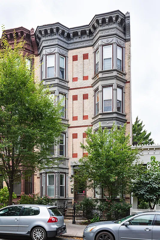 356 12th Street, Unit 2A Brooklyn, NY 11215 - Photo 6 of 7 a front view of a residential apartment building with a yard