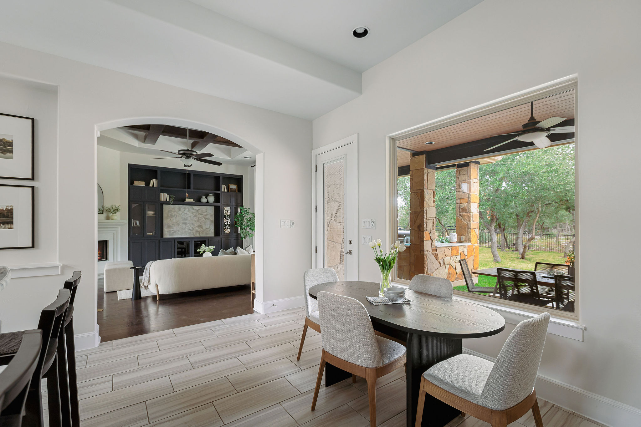 812 Jennings Branch Georgetown, TX 78633 - Photo 22 of 100 a view of a dining room with furniture large windows and wooden floor