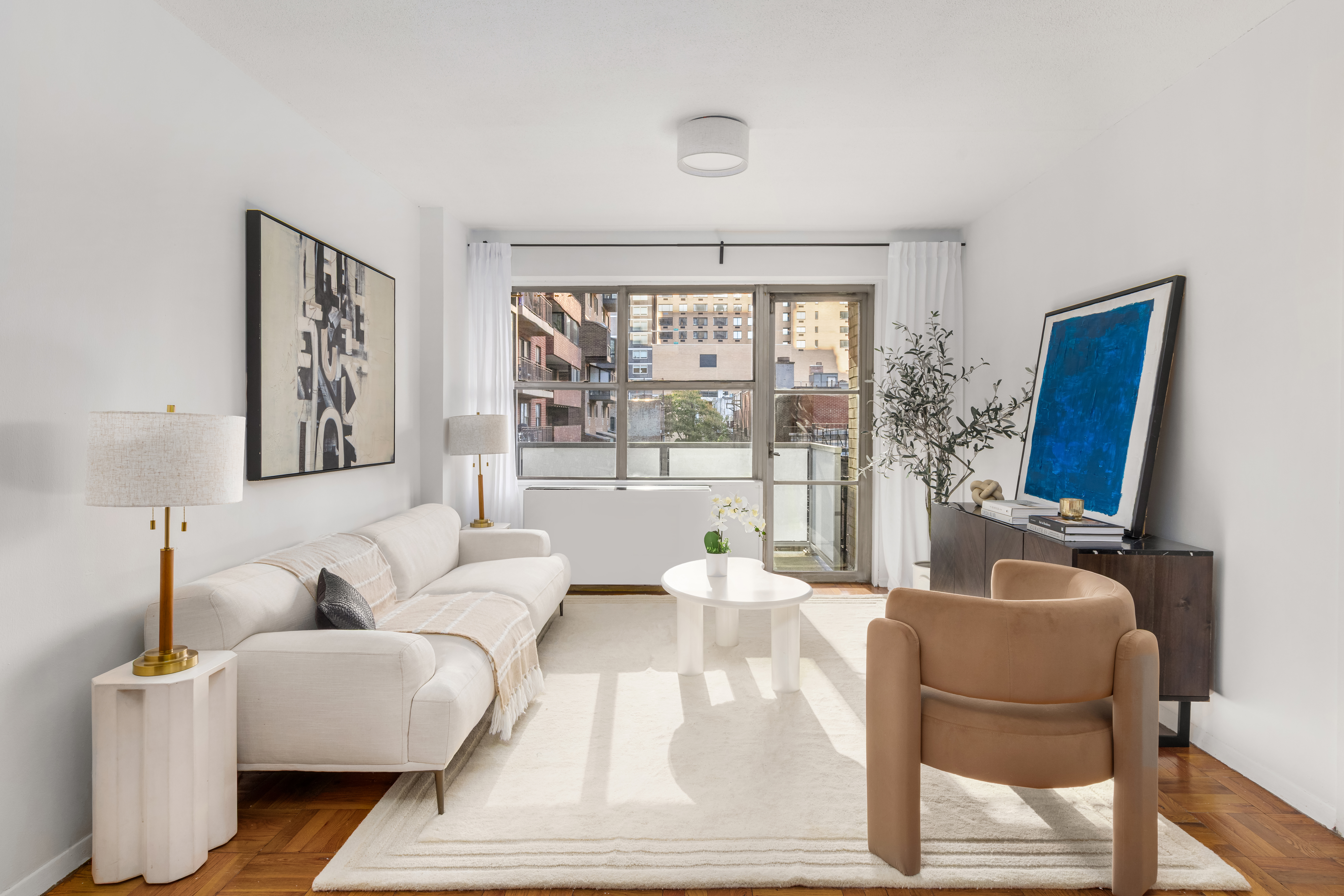 a living room with furniture and a window