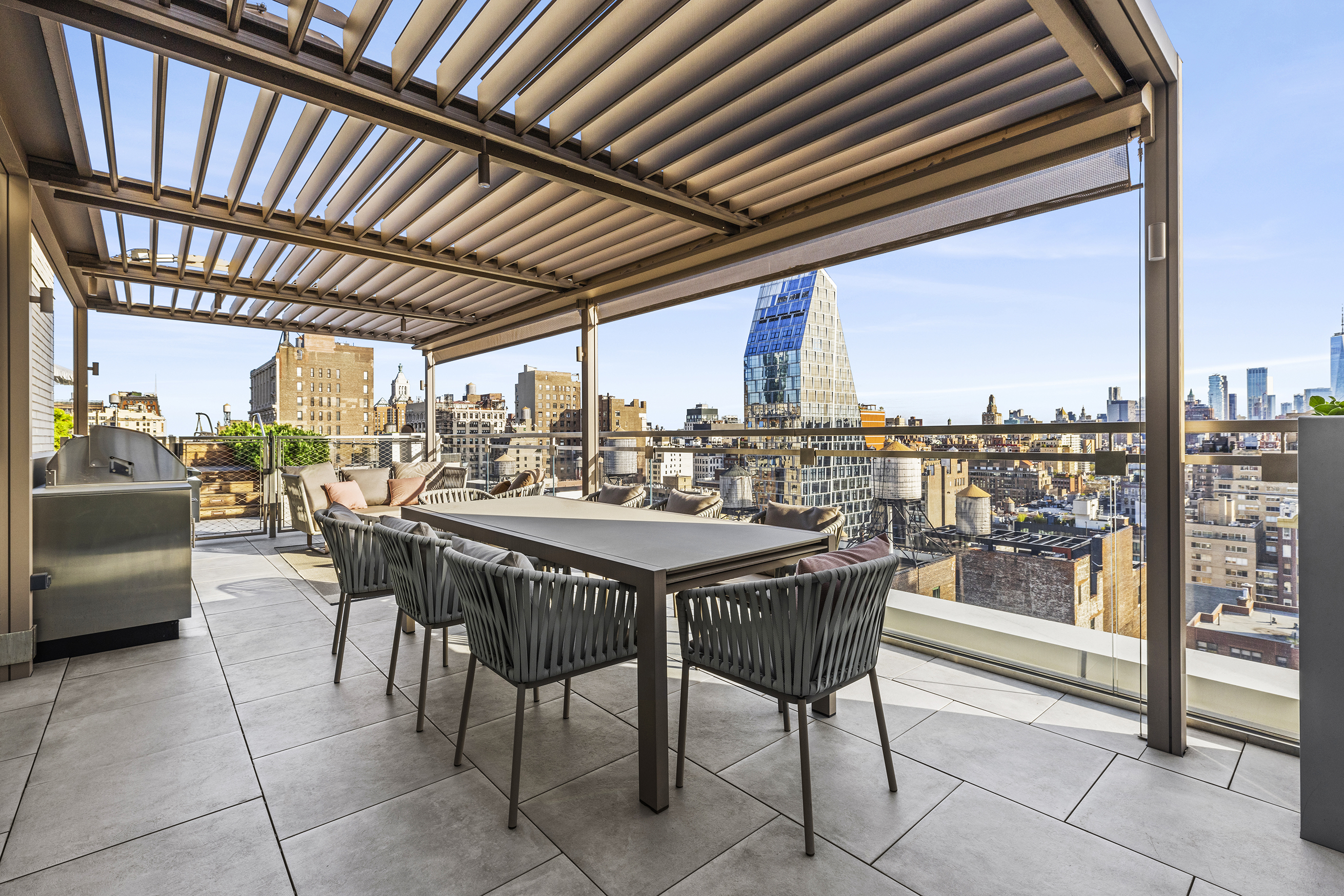 55 West 17th Street, Unit PH Manhattan, NY 10011 - Photo 20 of 36 a dining area with furniture and outdoor view