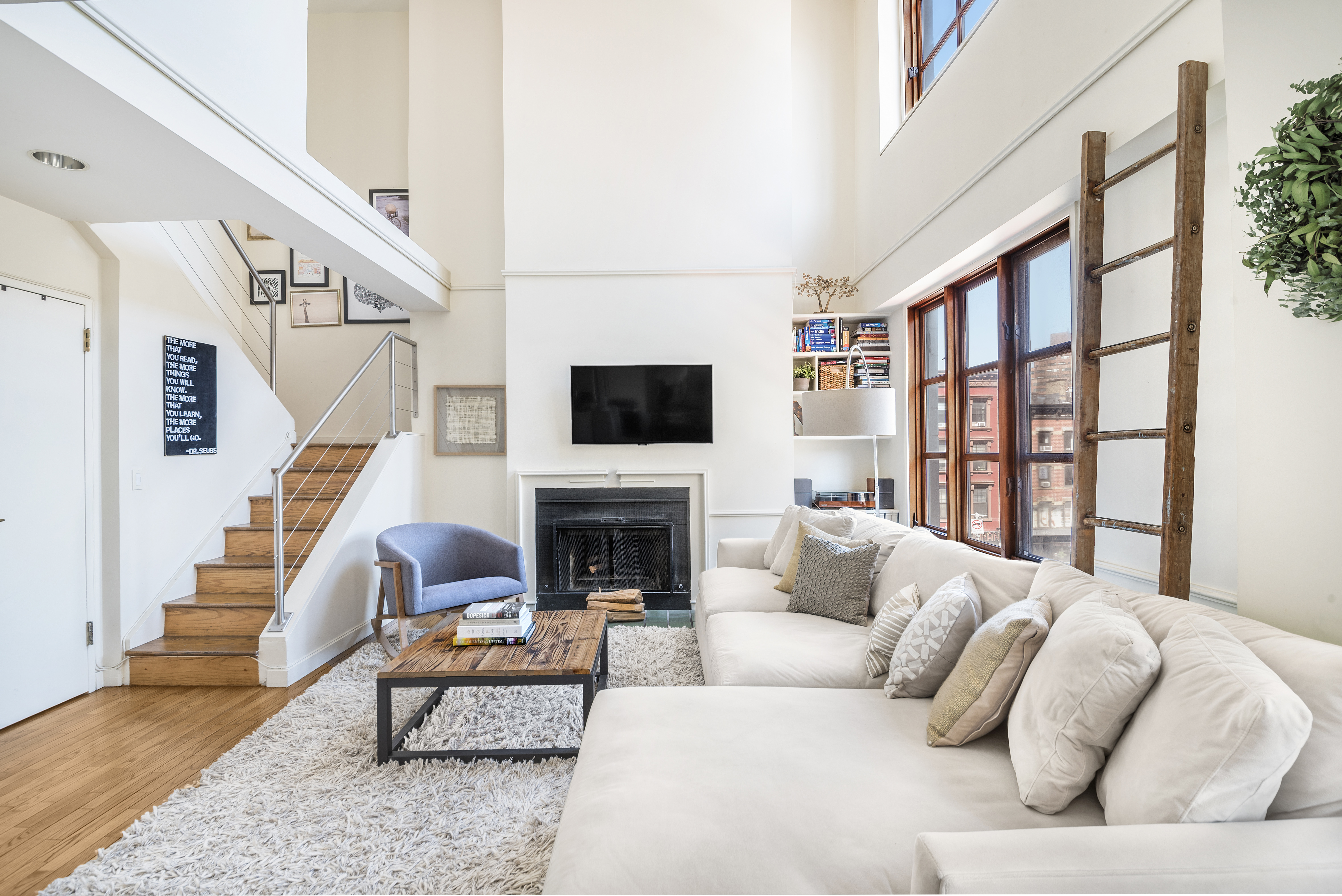 a living room with furniture fireplace and a flat screen tv