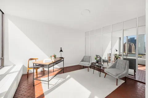 a living room with furniture and a table