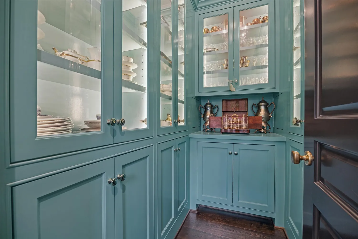a kitchen with stainless steel appliances white cabinets and a large window