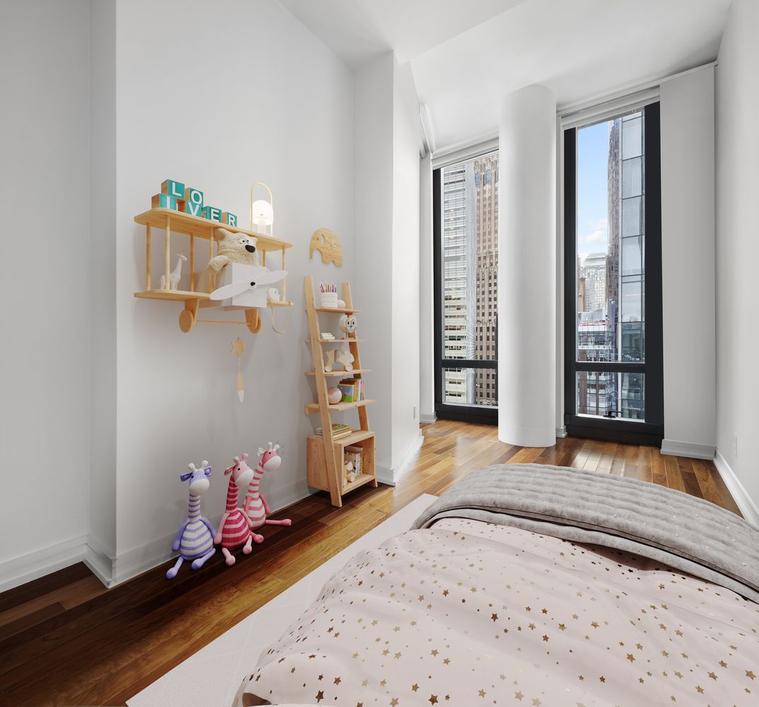 101 Warren Street, Unit 11L Manhattan, NY 10007 - Photo 15 of 26 a bedroom with a bed and a window