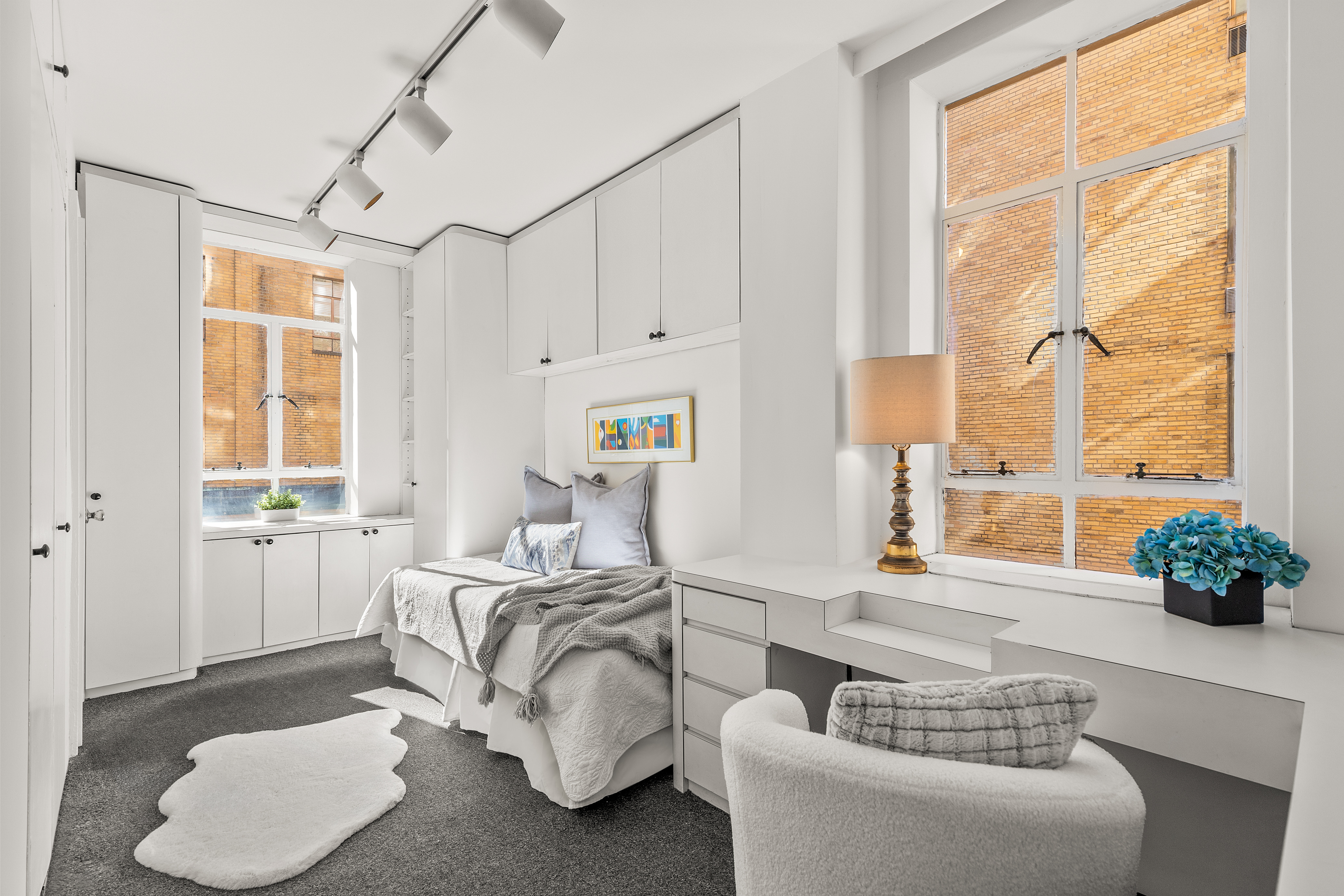 115 Central Park West, Unit 16H Manhattan, NY 10023 - Photo 22 of 30 a living room with furniture and a large window