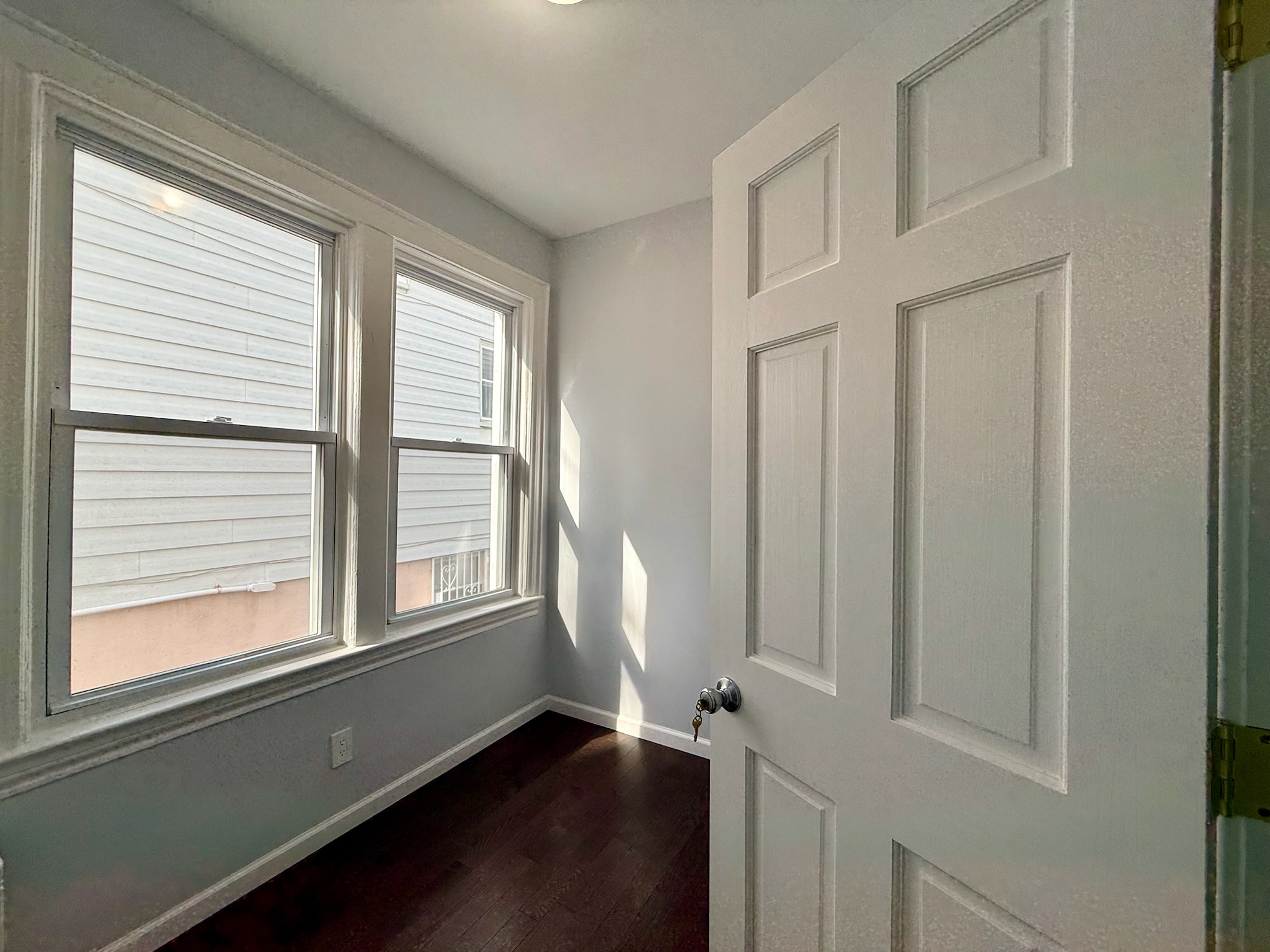 1675 85th Street, Unit 1F Brooklyn, NY 11214 - Photo 3 of 7 a view of empty room with a window