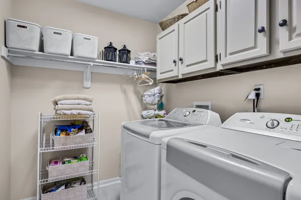 a bedroom with furniture and a wooden floor