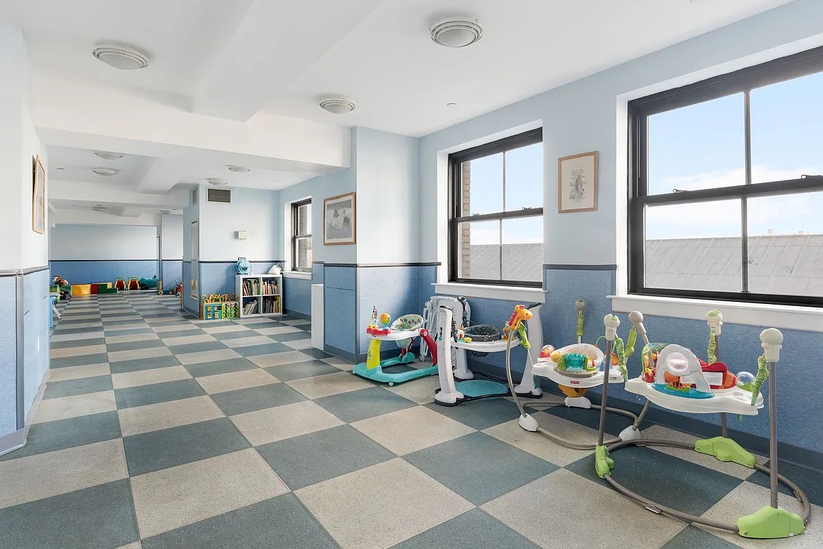 1 Hanson Place, Unit 16F Brooklyn, NY 11243 - Photo 13 of 15 a living room filled with furniture and a dining table