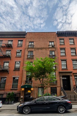 133 East 15th Street, Unit 1B Manhattan, NY 10003 - Photo 10 of 12 front view of a house with a street