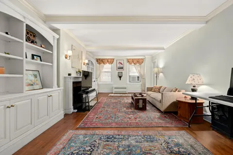 a living room with fireplace furniture or couch and a rug