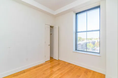 a view of an empty room with a window