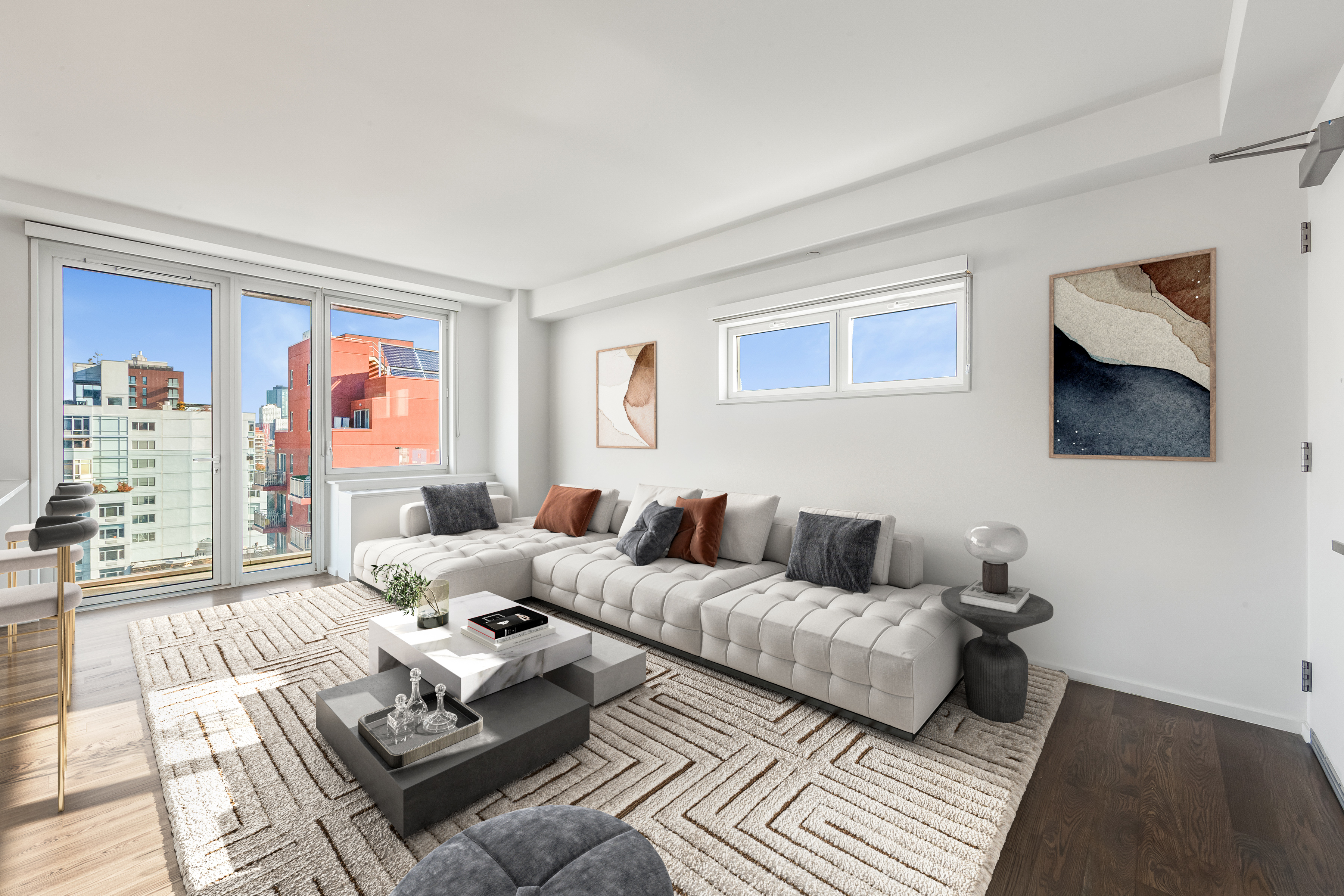 a living room with furniture a flat screen tv and a window