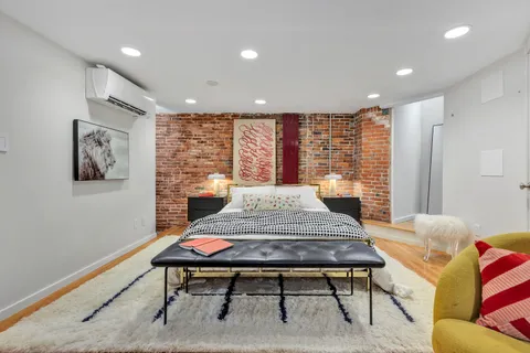 a bedroom with a bed and a table