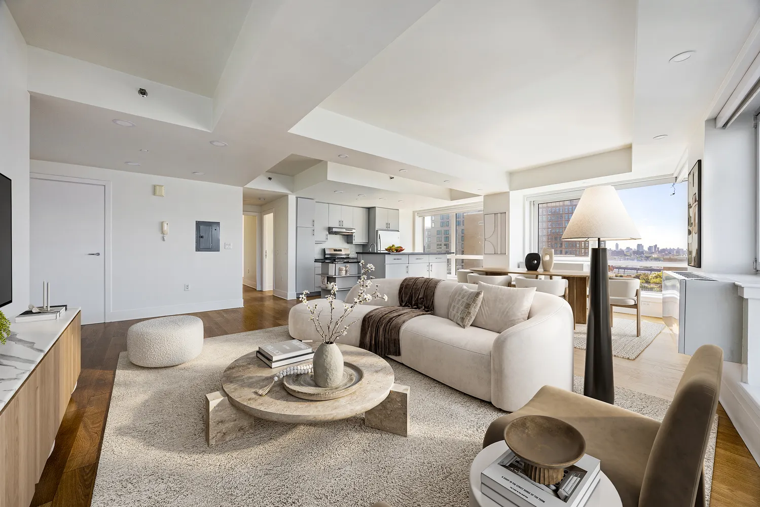 a living room with furniture and a wooden floor