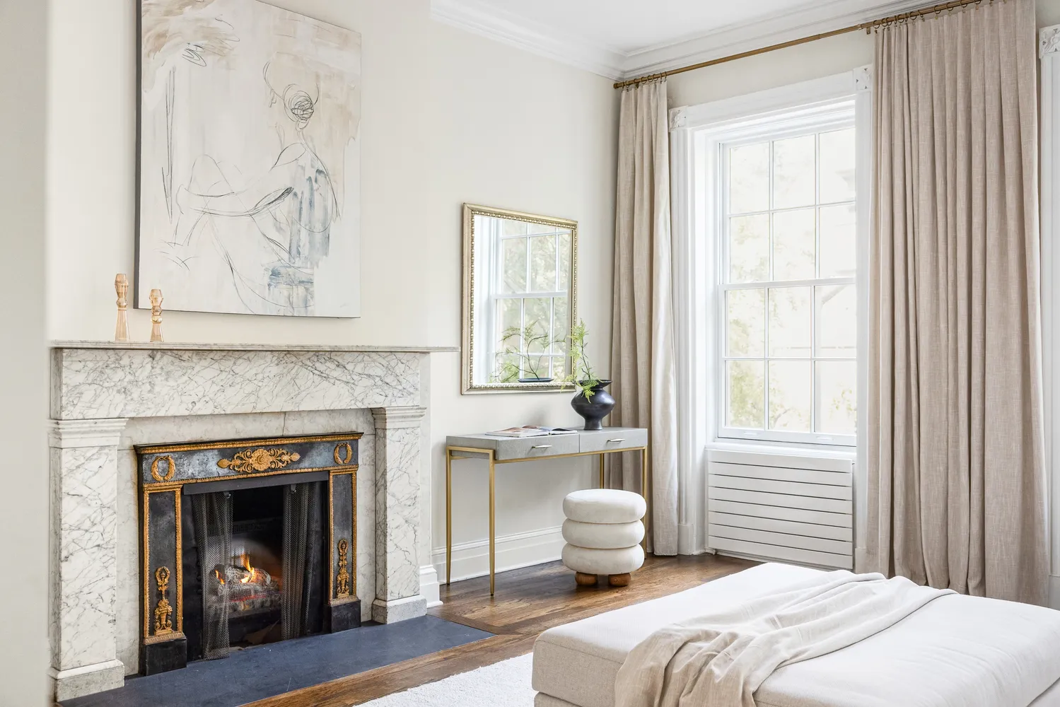 a bedroom with a fireplace with a fireplace