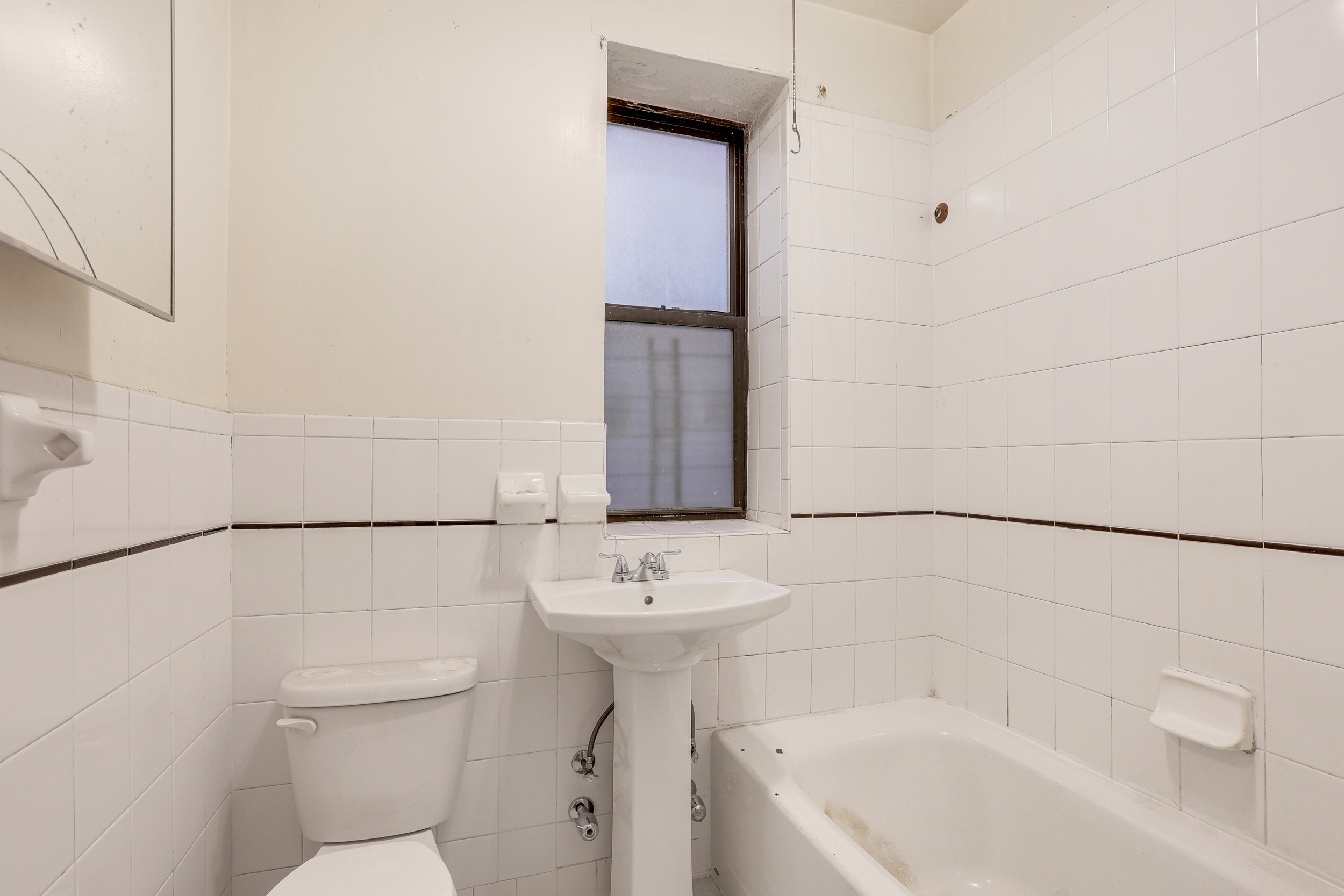 282 Manhattan Avenue, Unit 3N Manhattan, NY 10026 - Photo 15 of 17 a bathroom with a sink a toilet and shower
