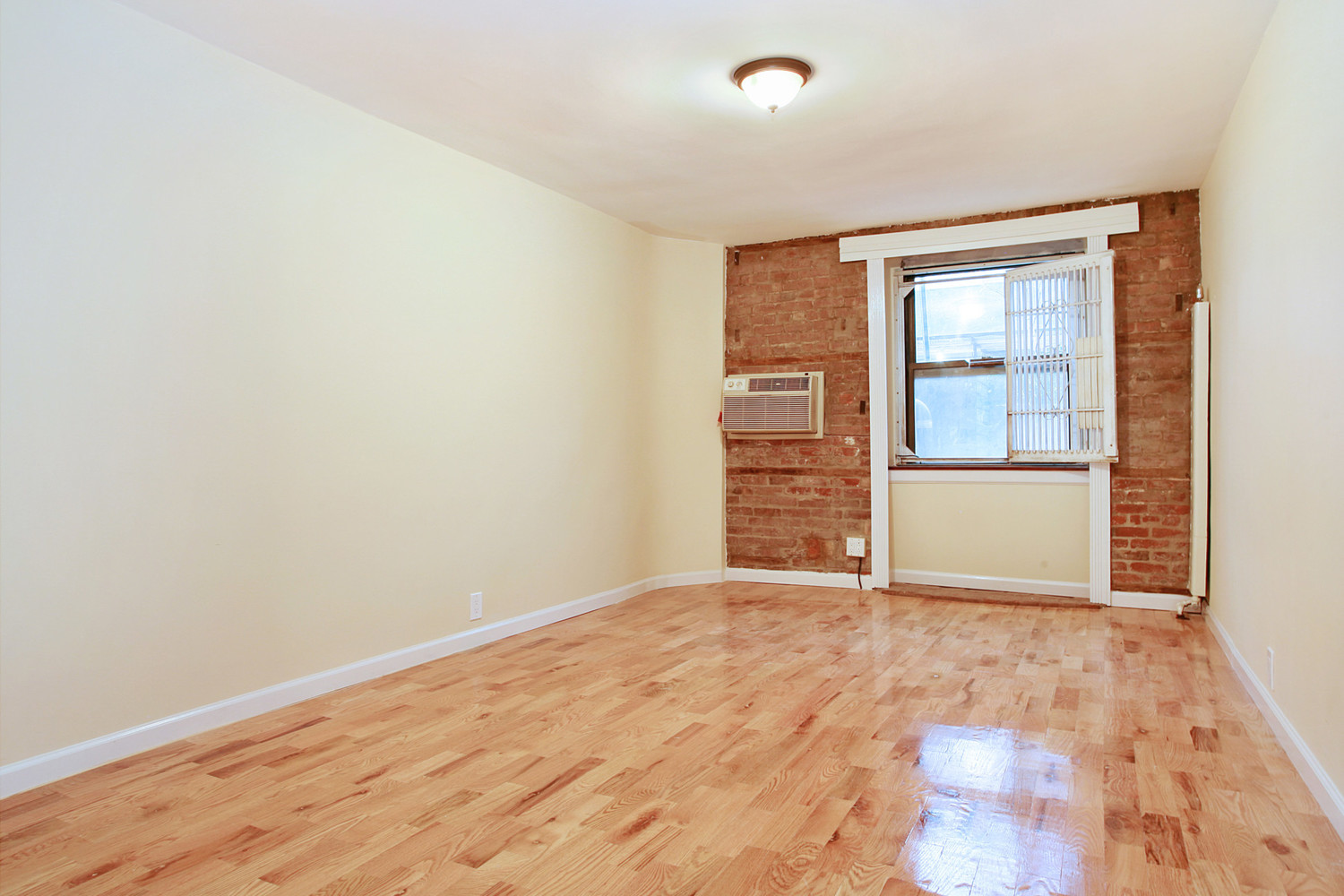 131 East 15th Street, Unit 1C Manhattan, NY 10003 - Photo 1 of 4 an empty room with a natural light