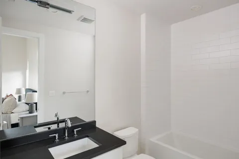 a bathroom with a sink toilet and bathtub
