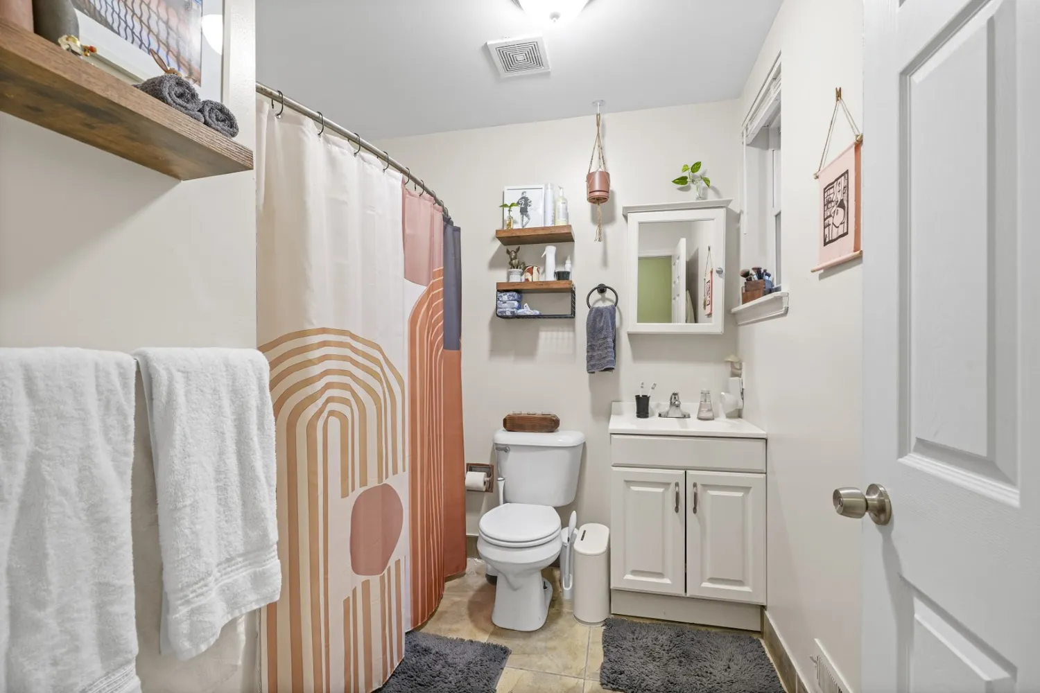 a view of a chairs and table in the back yard of the house