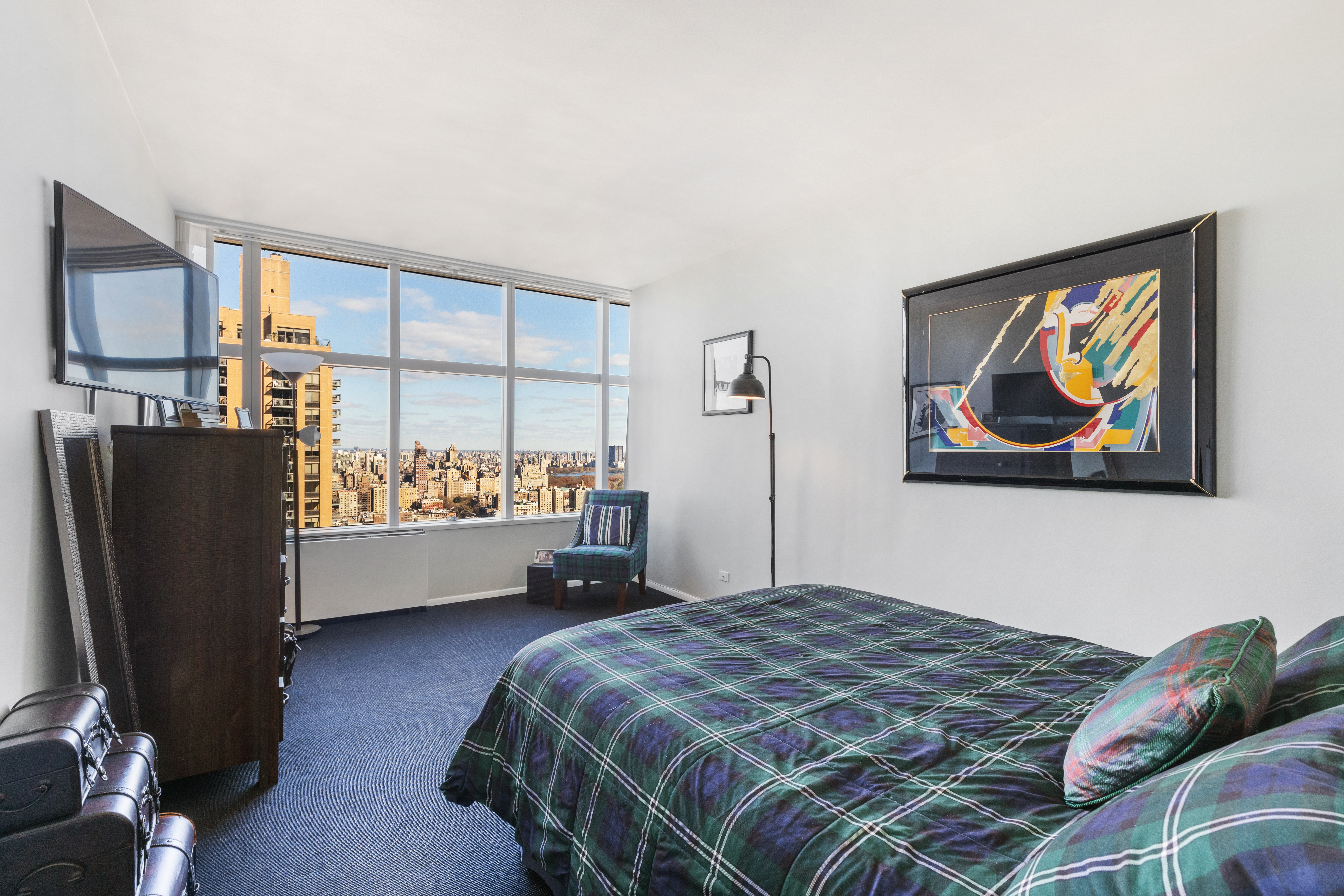 160 West 66th Street, Unit 42AB Manhattan, NY 10023 - Photo 10 of 15 a bedroom with a bed and a window
