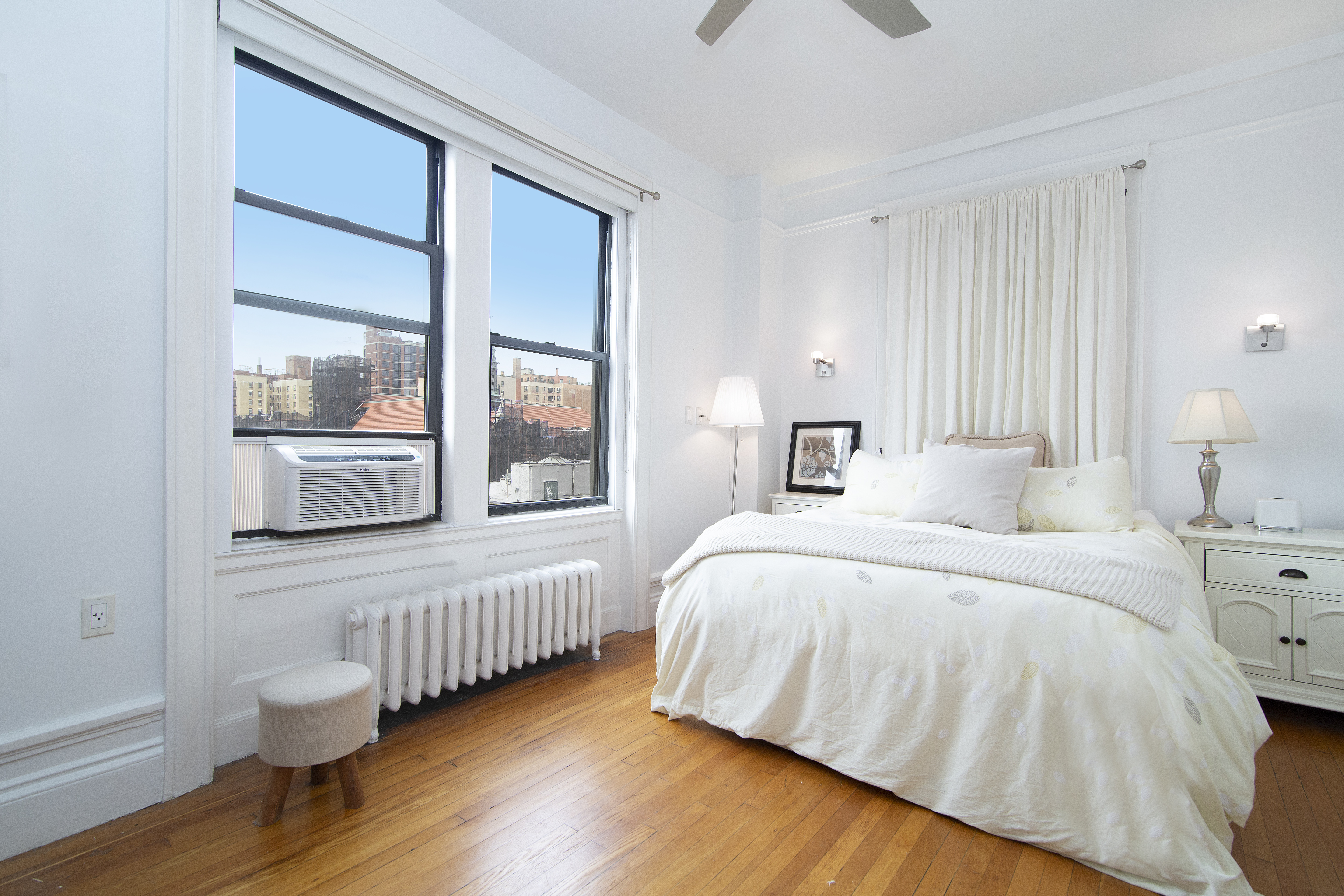 504 West 110th Street, Unit 8F Manhattan, NY 10025 - Photo 3 of 7 a bedroom with a bed and a window