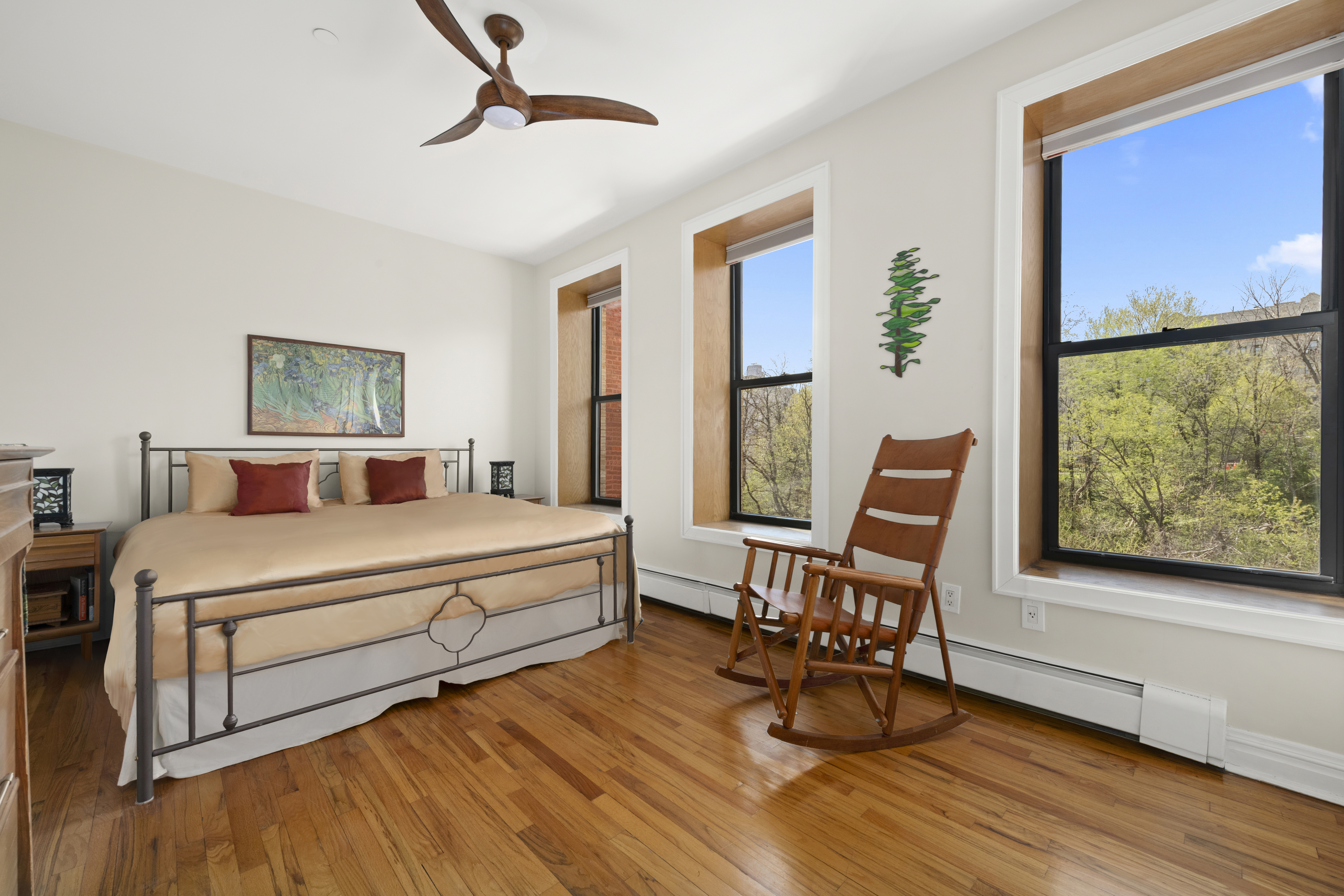 370 St Nicholas Avenue, Unit PH5B Manhattan, NY 10027 - Photo 6 of 12 a bedroom with a bed and a large window