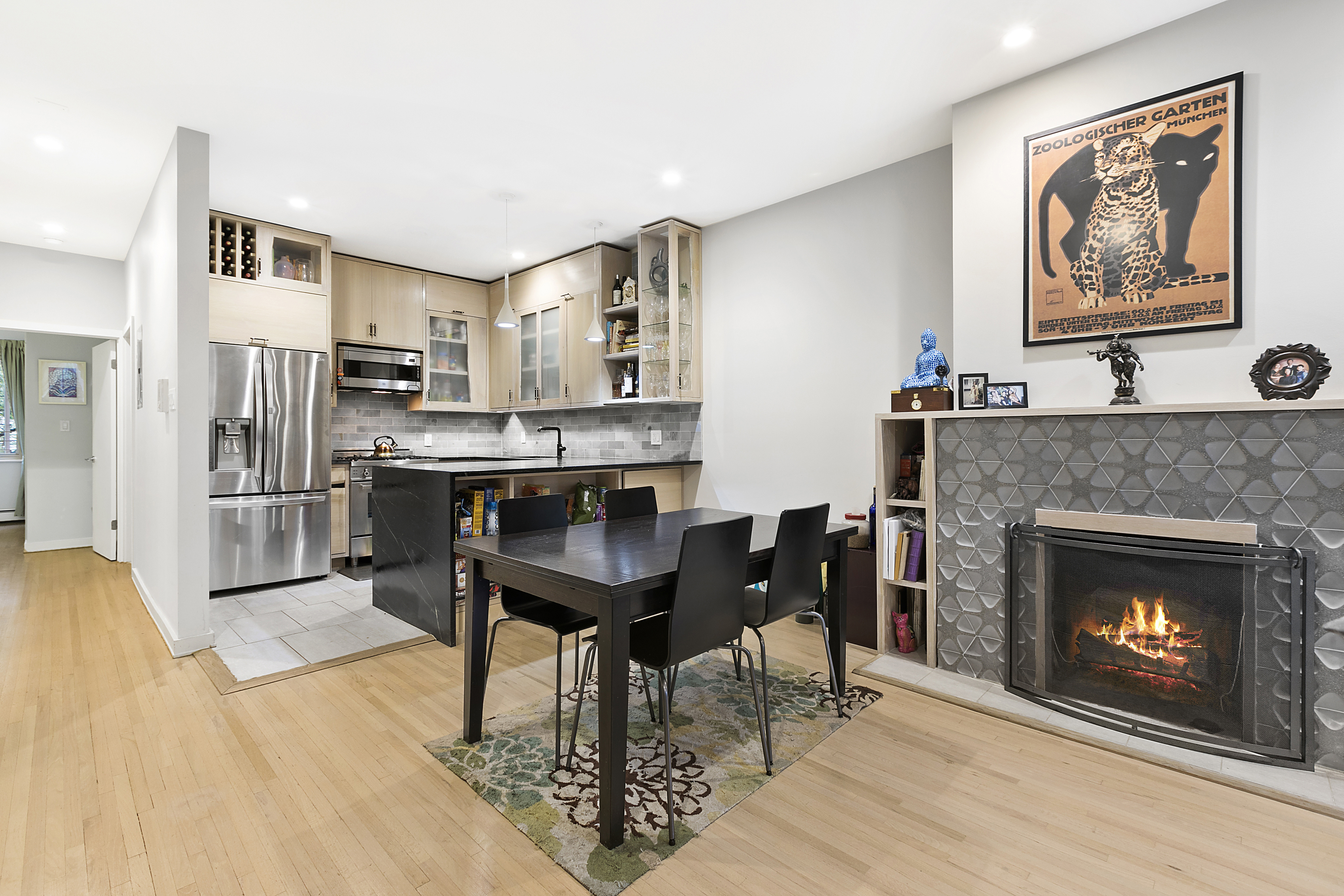 a view of a kitchen with furniture and fireplace