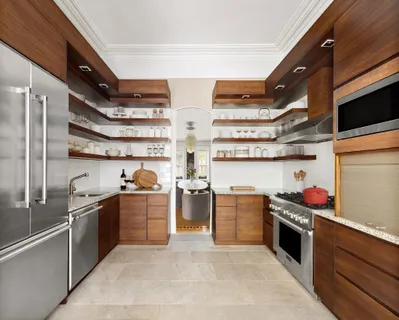 a kitchen with stainless steel appliances granite countertop a sink and cabinets