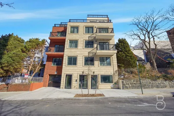 a front view of a building with street