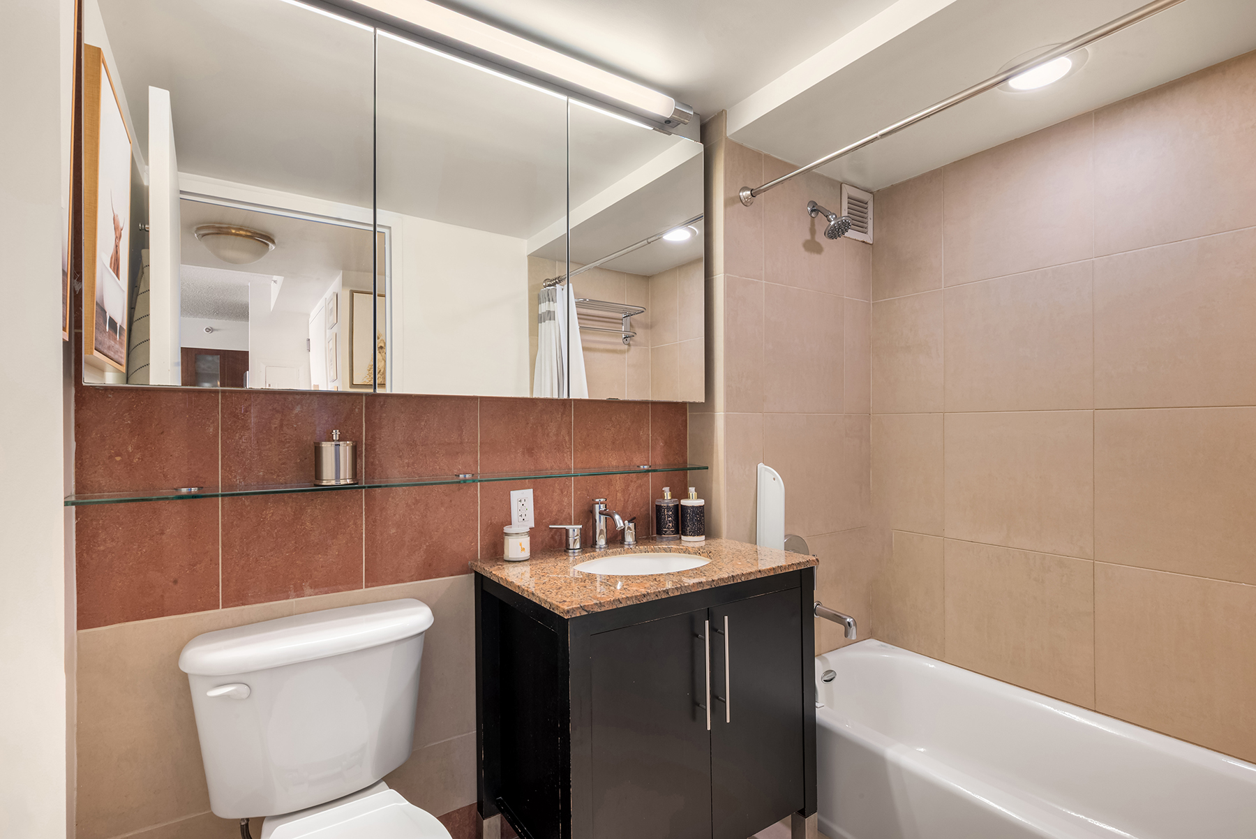 555 West 23rd Street, Unit S11C Manhattan, NY 10011 - Photo 4 of 12 a bathroom with a sink toilet and shower