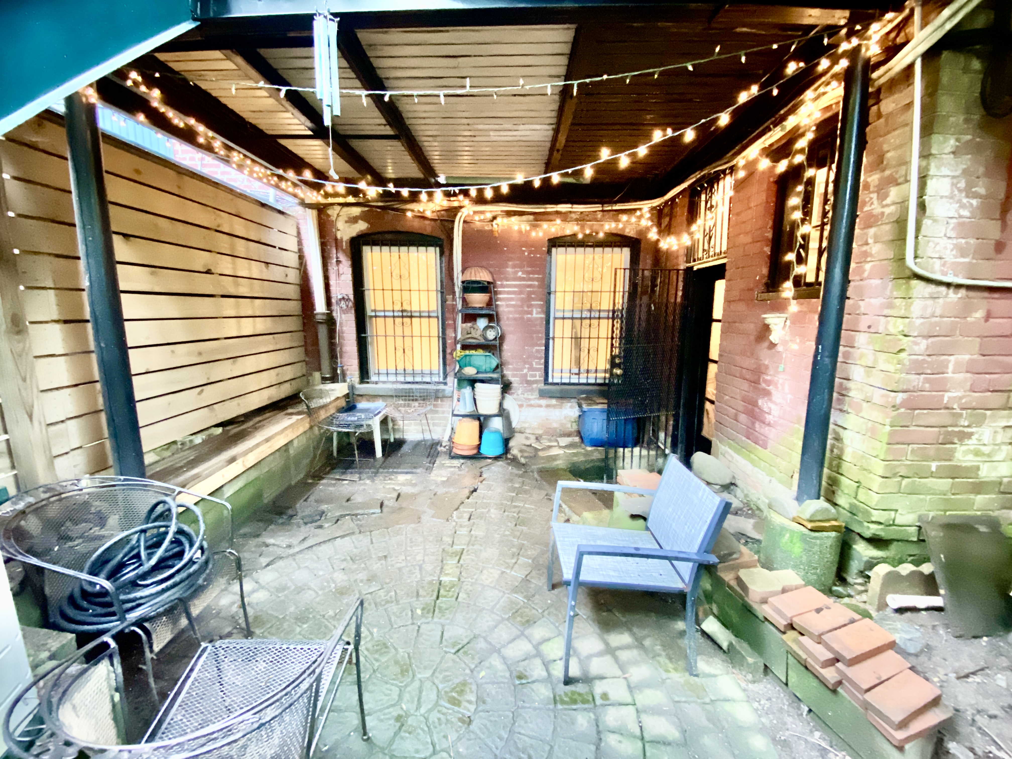 119 Gates Avenue, Unit 1 Brooklyn, NY 11238 - Photo 6 of 11 a living room with furniture and a potted plant