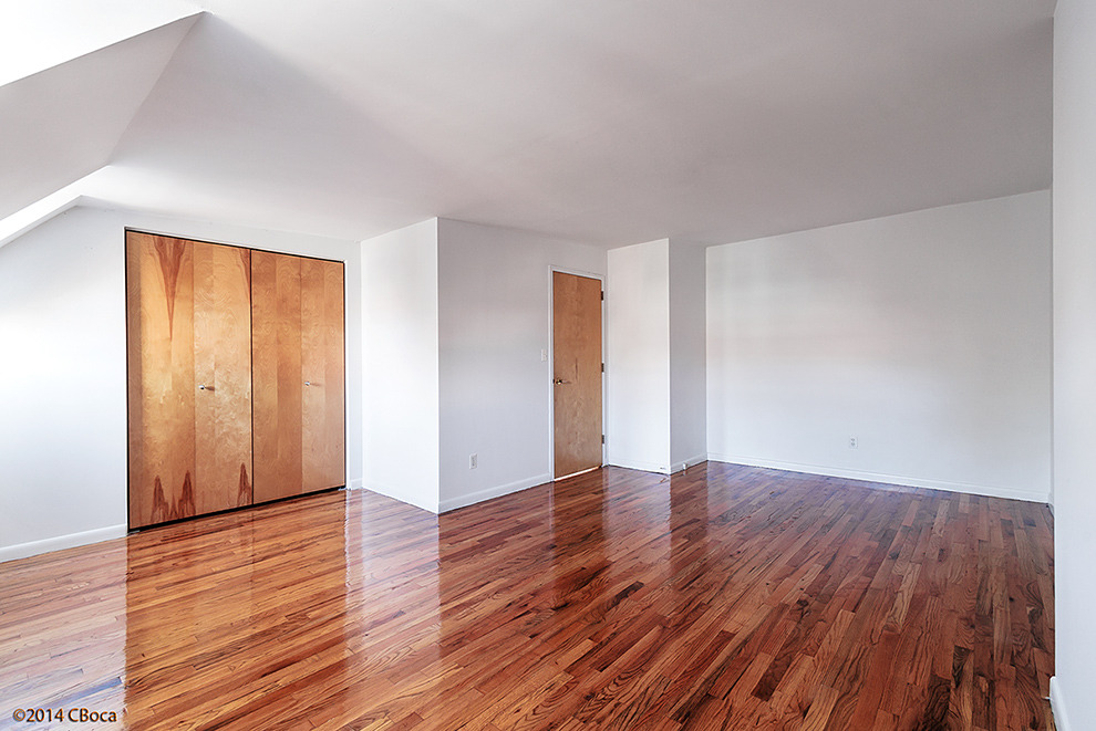 404 Classon Avenue, Unit 2 Brooklyn, NY 11238 - Photo 11 of 14 a view of an empty room with wooden floor and closet