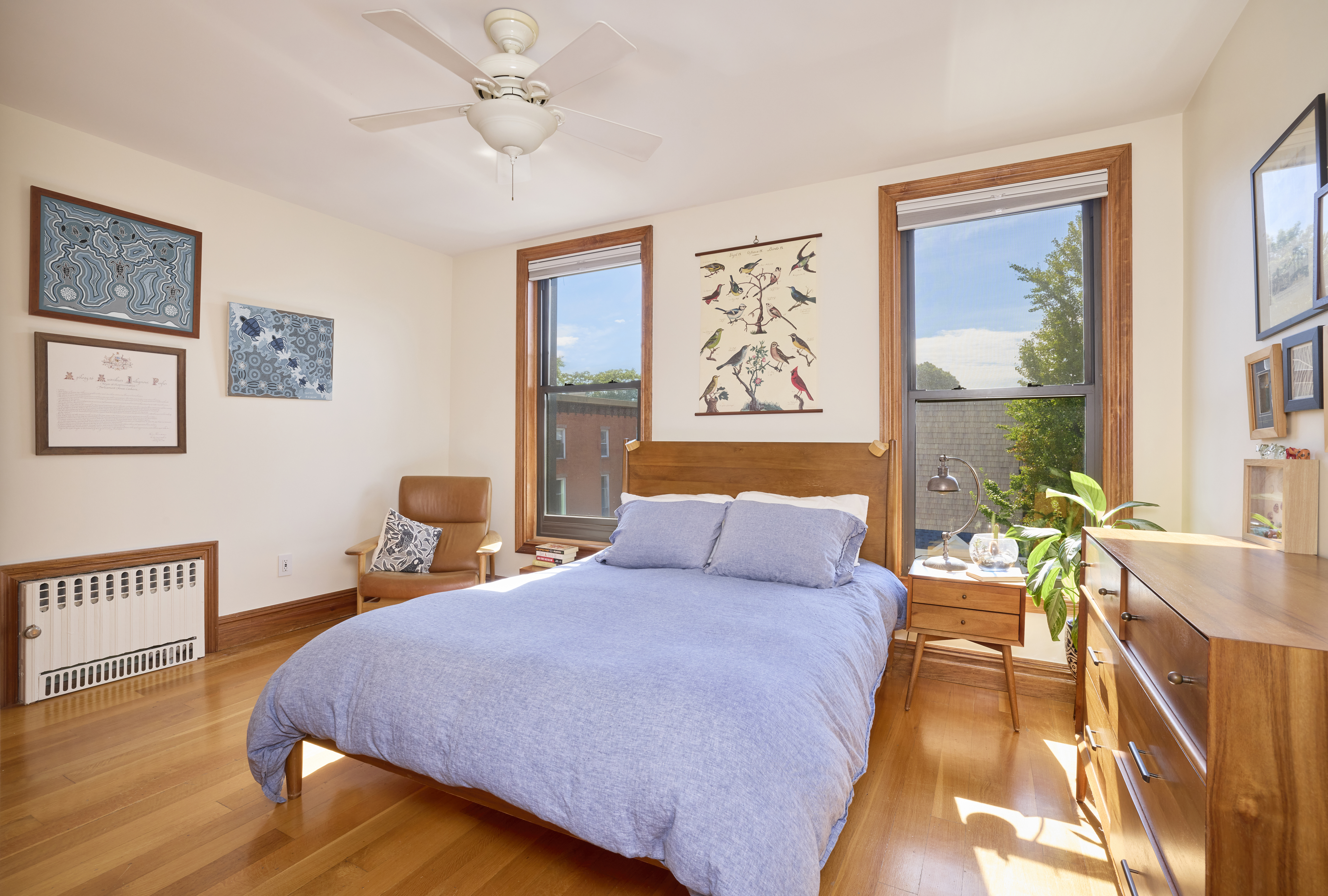 1702 8th Avenue, Unit 3 Brooklyn, NY 11215 - Photo 6 of 15 a bedroom with a bed and a chandelier