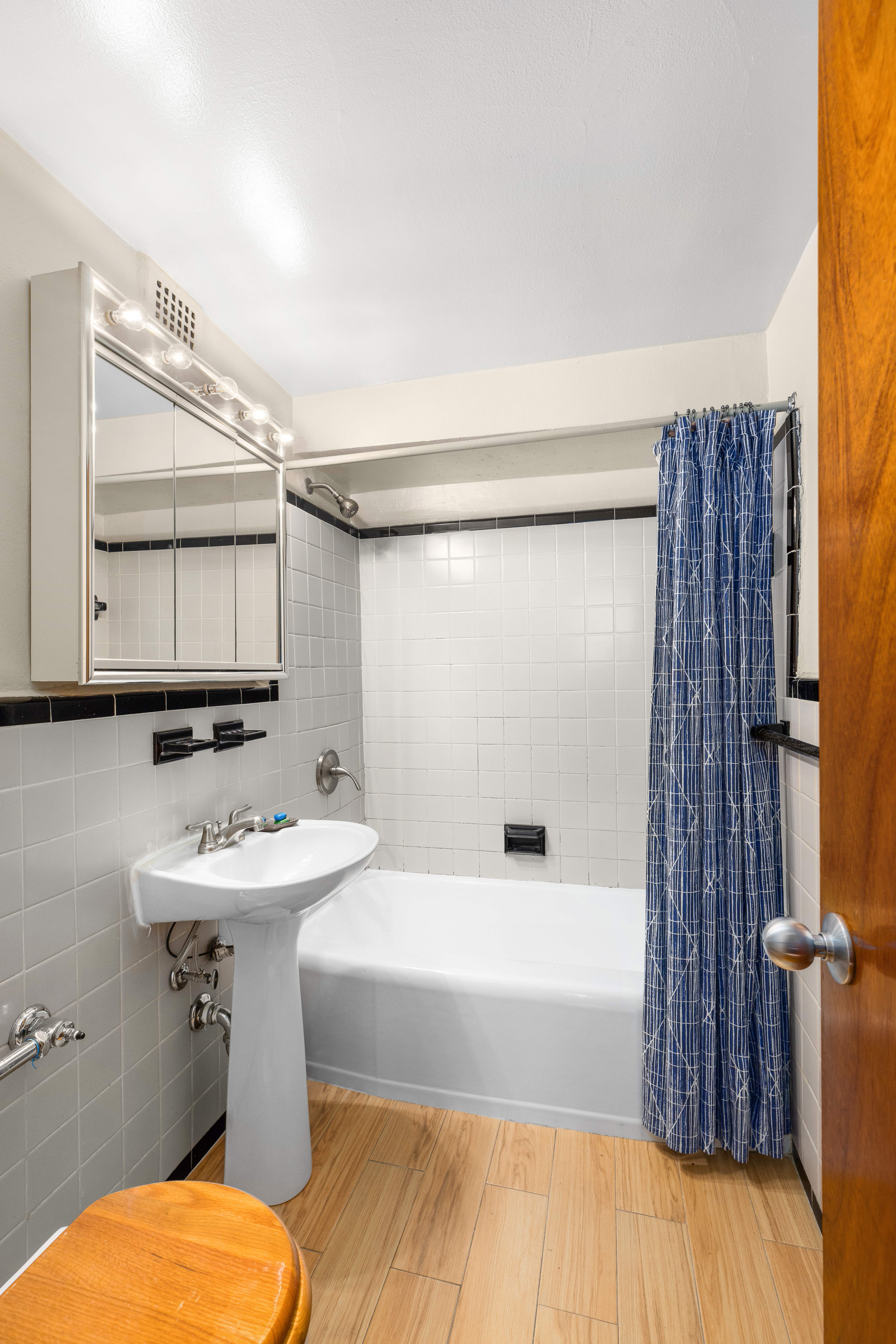 310 Beverley Road, Unit LB Brooklyn, NY 11218 - Photo 7 of 9 a bathroom with a sink mirror toilet and bathtub