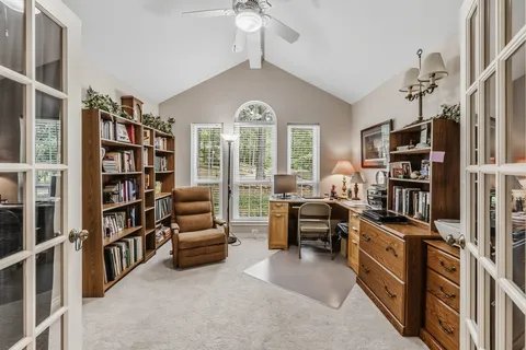 a view of a livingroom with furniture and windows