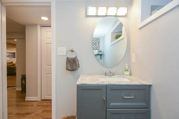 a bathroom with a sink and a mirror