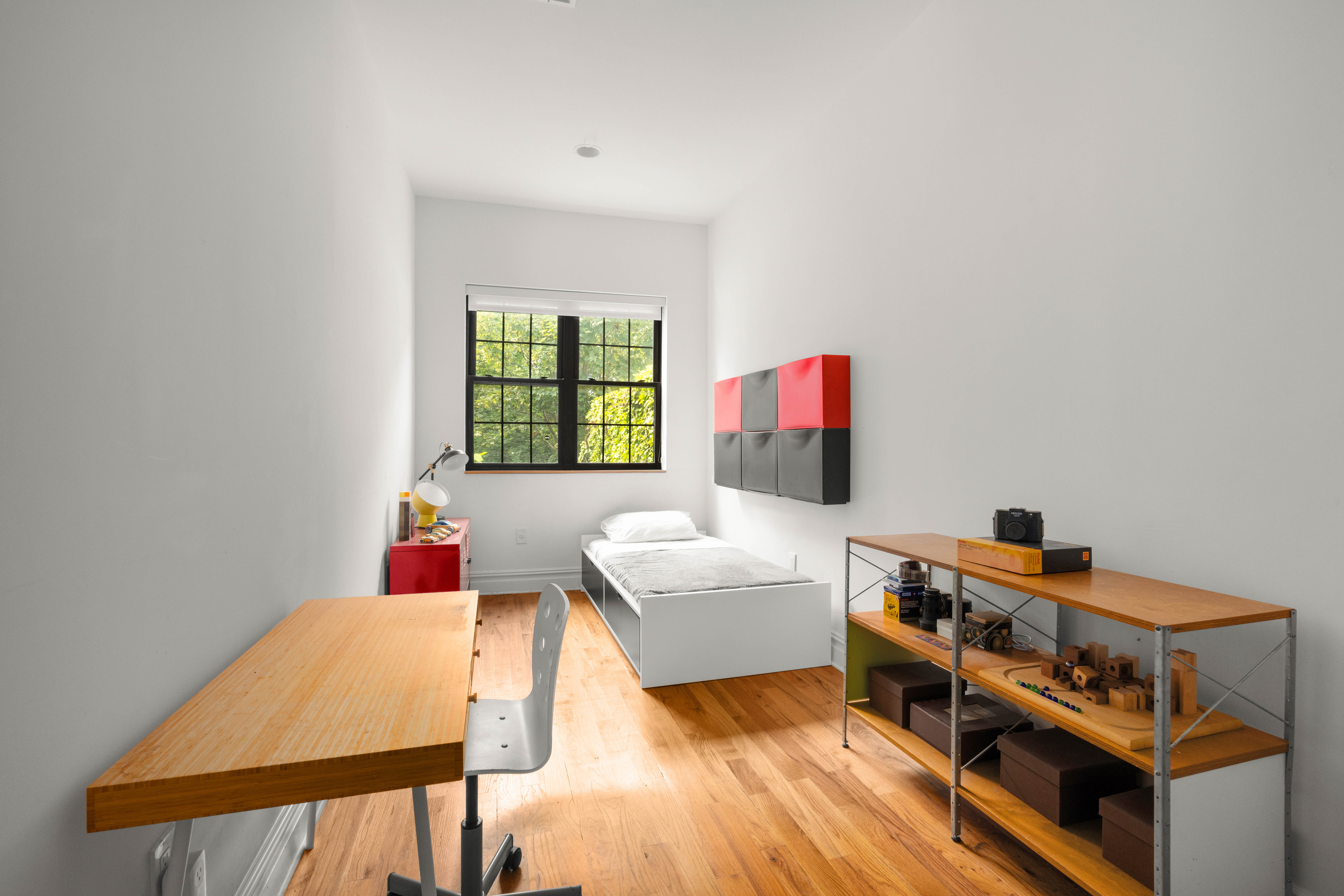 748 Madison Street, Unit 1 Brooklyn, NY 11221 - Photo 6 of 10 a bedroom with furniture and a window