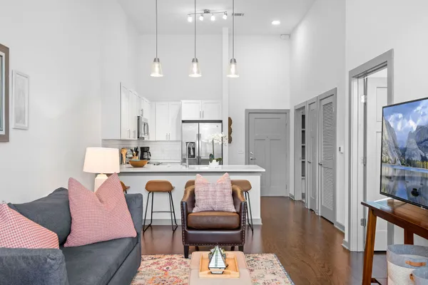 a large kitchen with a table and chairs