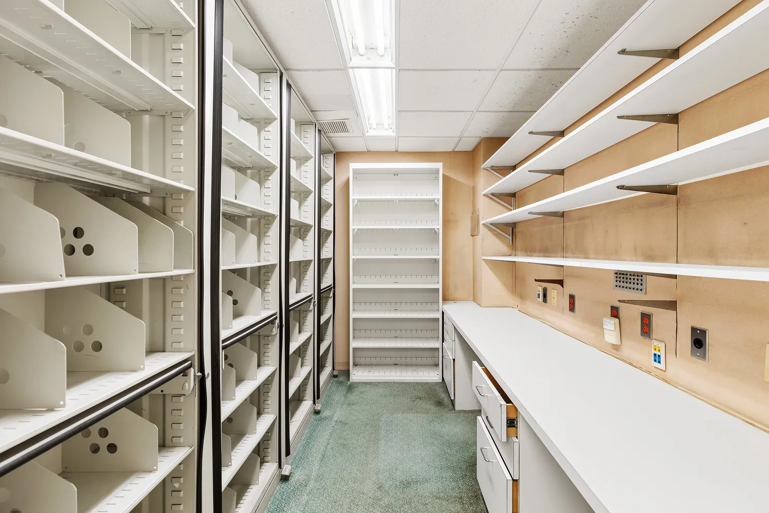 a room with pool table and windows