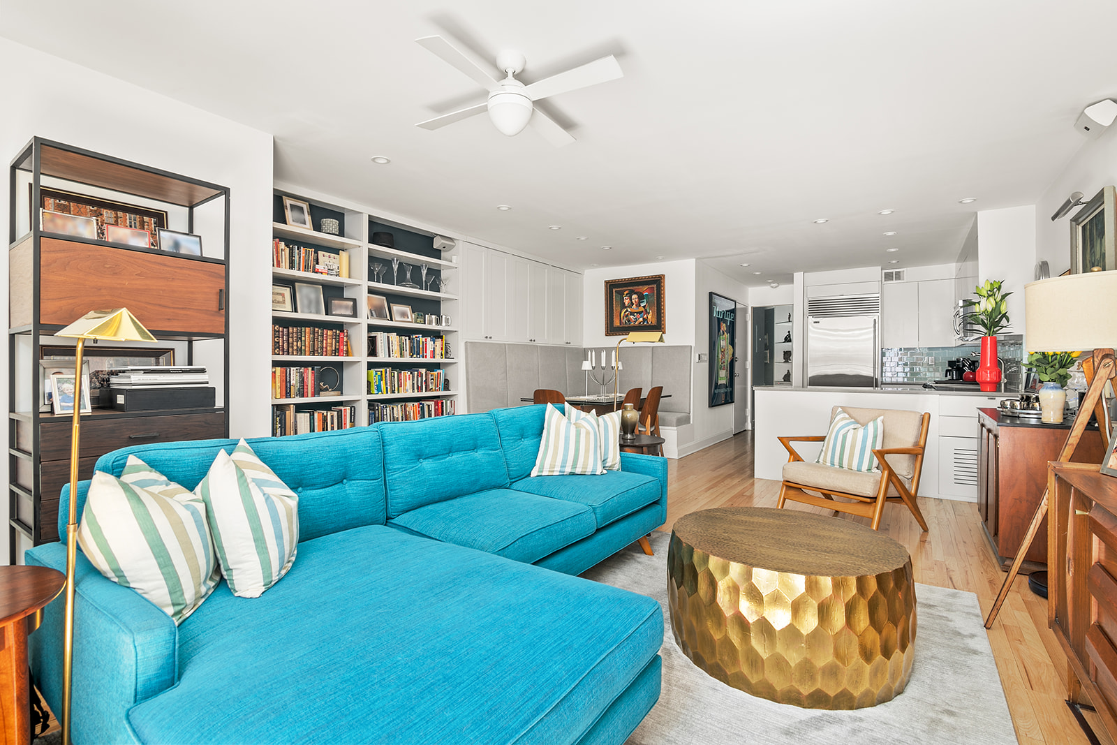 24 West 70th Street, Unit 1 Manhattan, NY 10023 - Photo 3 of 15 a living room with furniture kitchen view and a large window