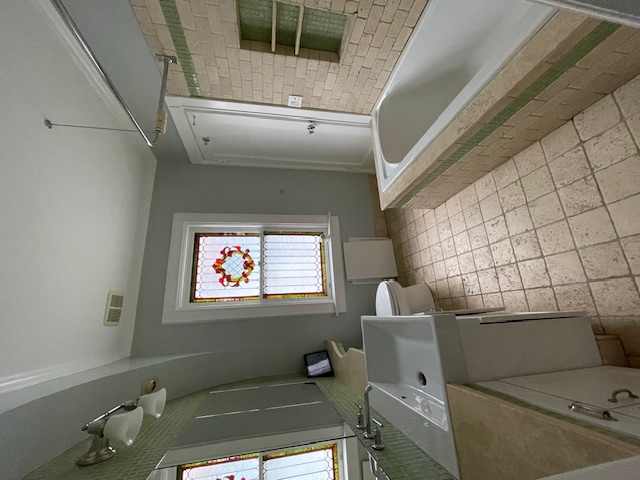 340 Marlborough Road Brooklyn, NY 11226 - Photo 17 of 27 a bathroom with a tub sink and mirror