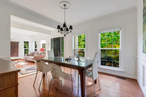 a very nice looking room with a large window and furniture