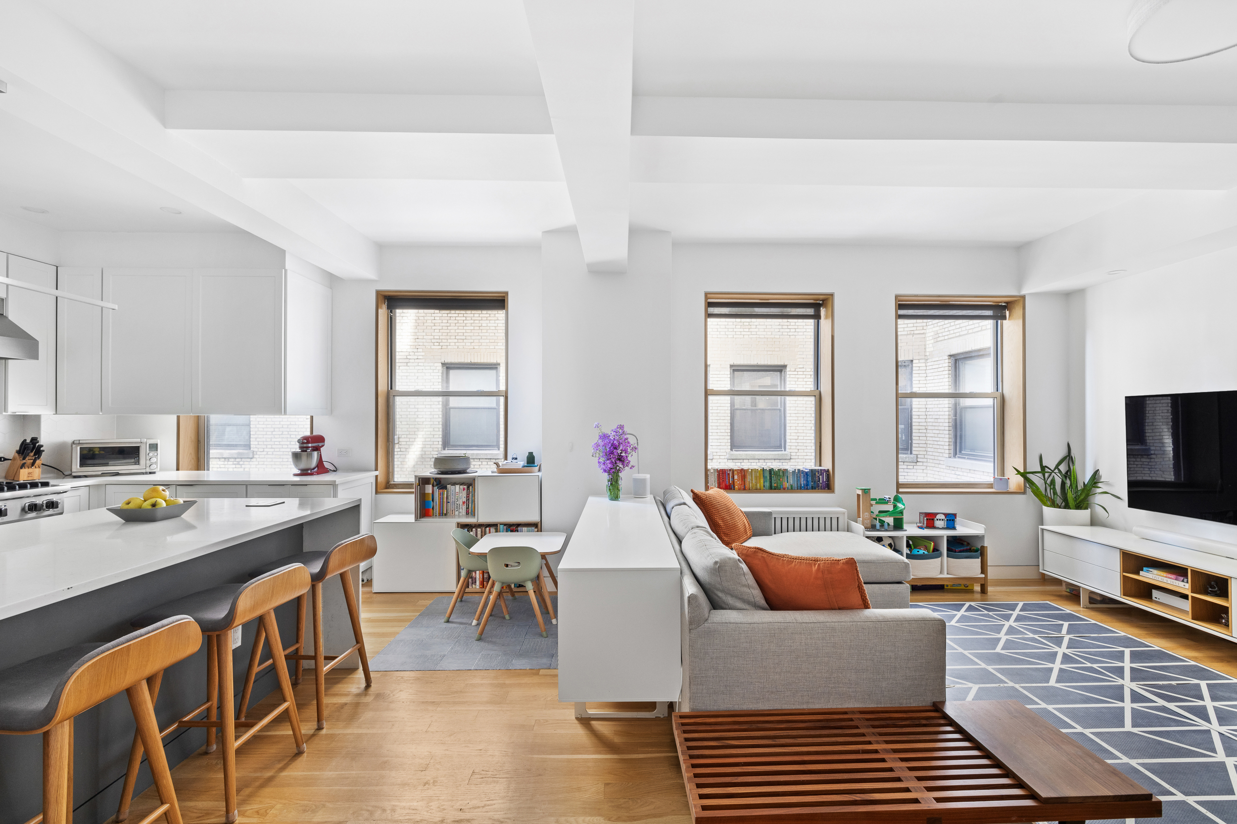 240 West 98th Street, Unit 8D Manhattan, NY 10025 - Photo 3 of 12 a living room with fireplace furniture and a flat screen tv