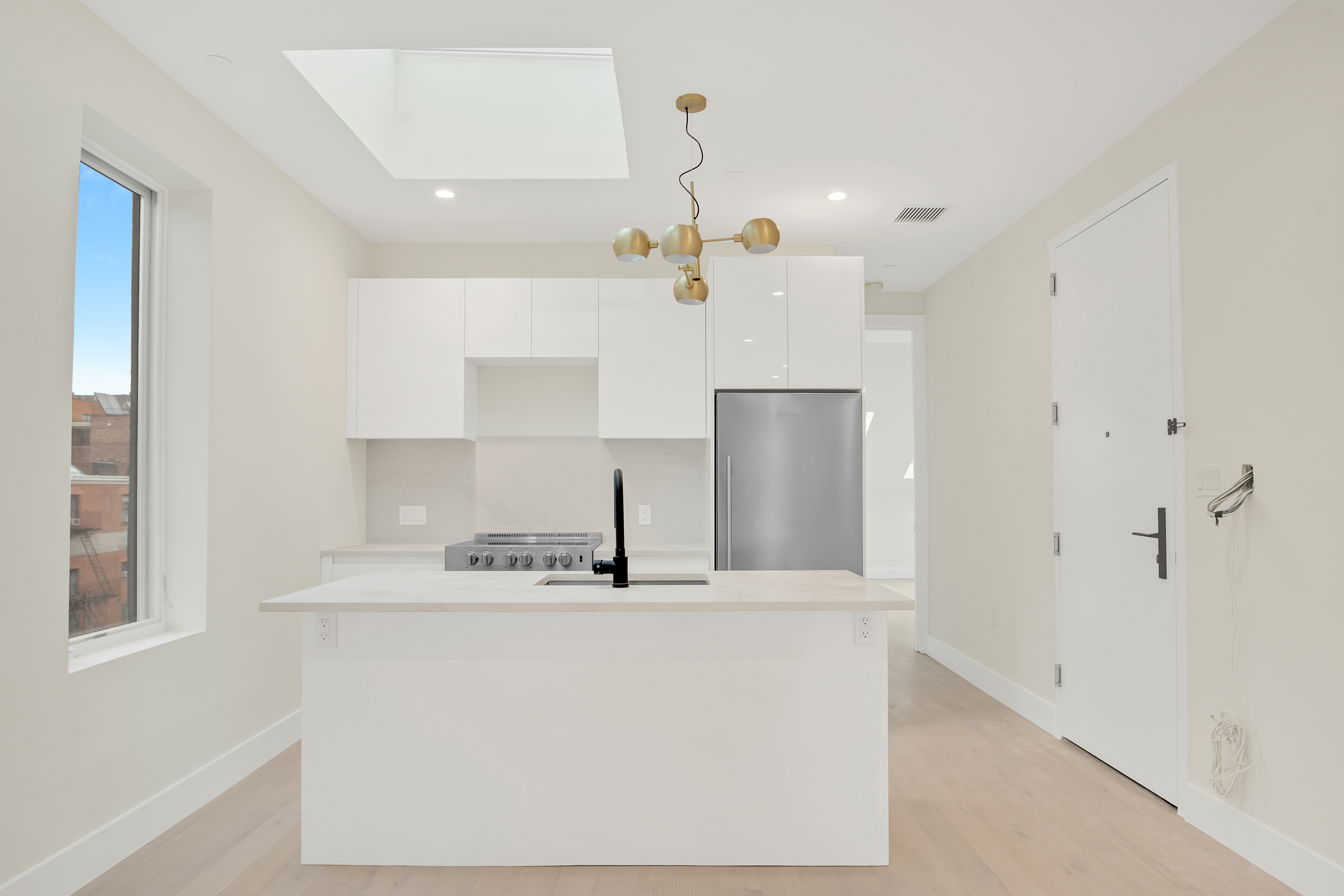 45 2nd Avenue, Unit 5 Manhattan, NY 10003 - Photo 3 of 8 a bathroom with a sink and a mirror