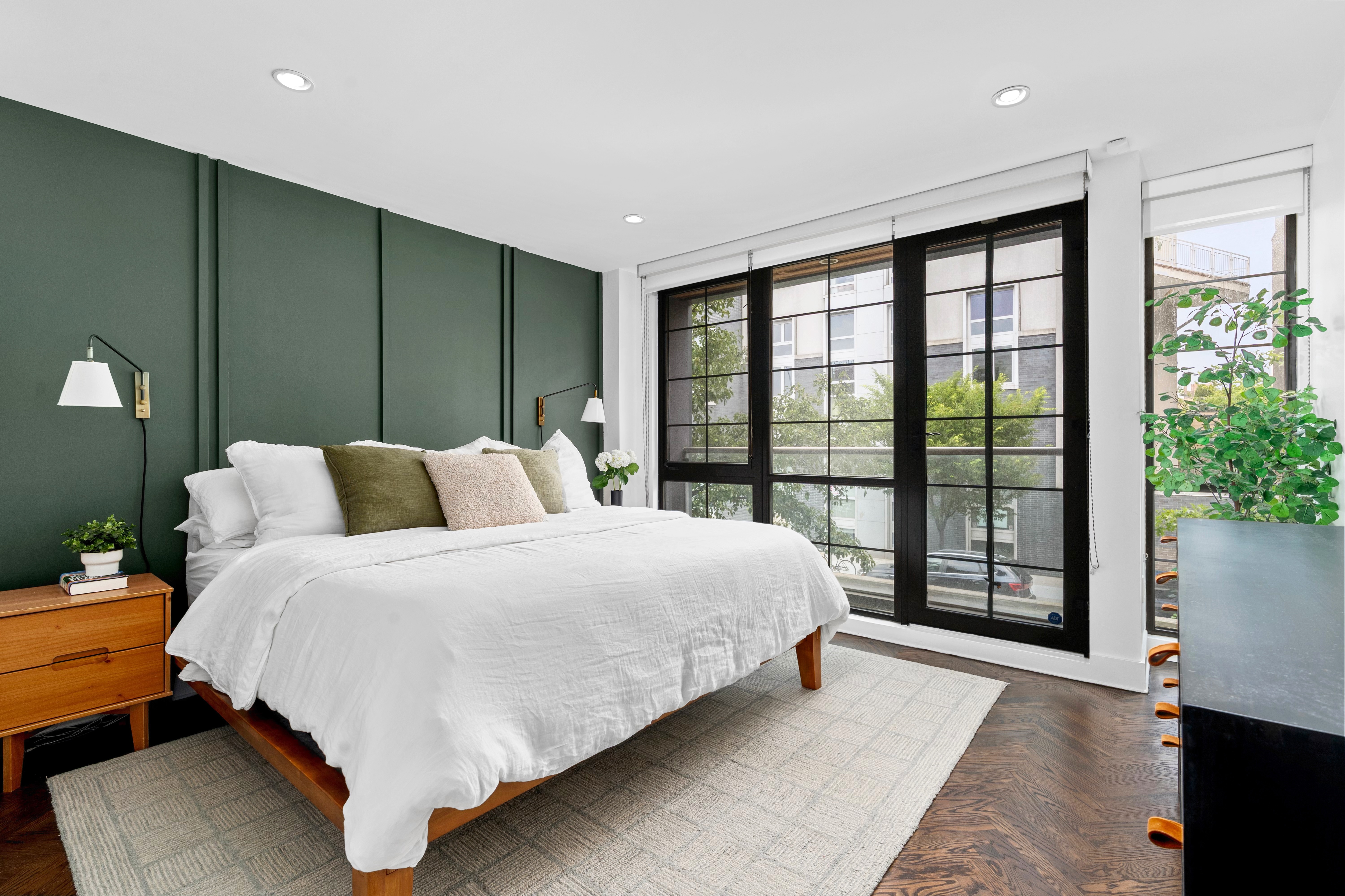 245 Manhattan Avenue, Unit 2A Brooklyn, NY 11211 - Photo 6 of 10 a spacious bedroom with a large bed and a large window